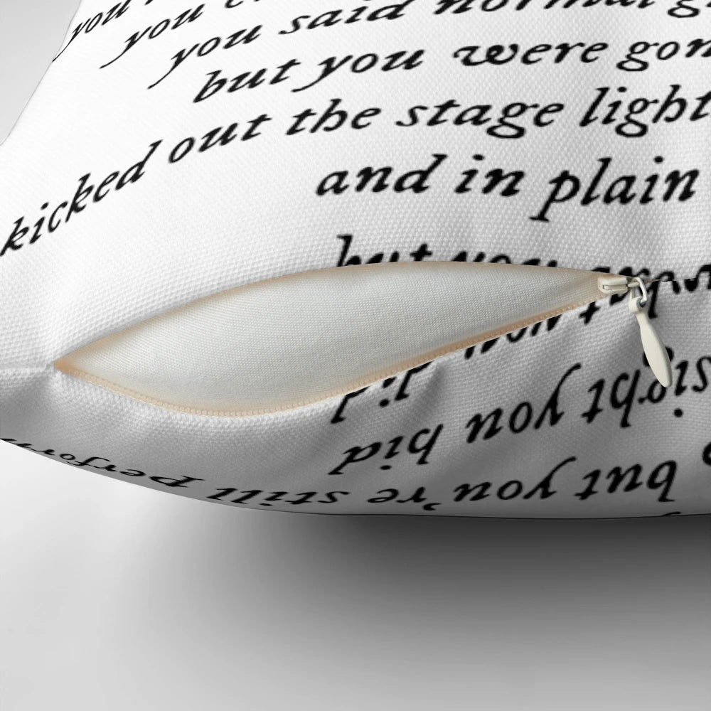 A plush pillow featuring the lyrics "the smallest man who ever lived" from Taylor Swift's songs.
