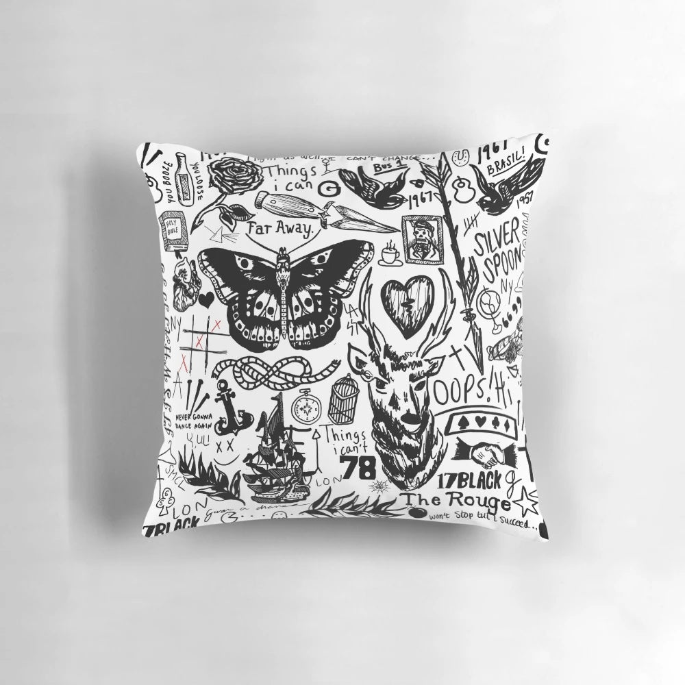 Collage of One Direction member tattoos printed on a plush pillow