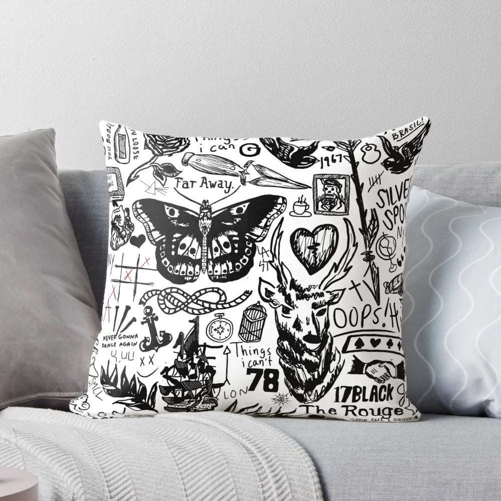 Collage of One Direction member tattoos printed on a plush pillow