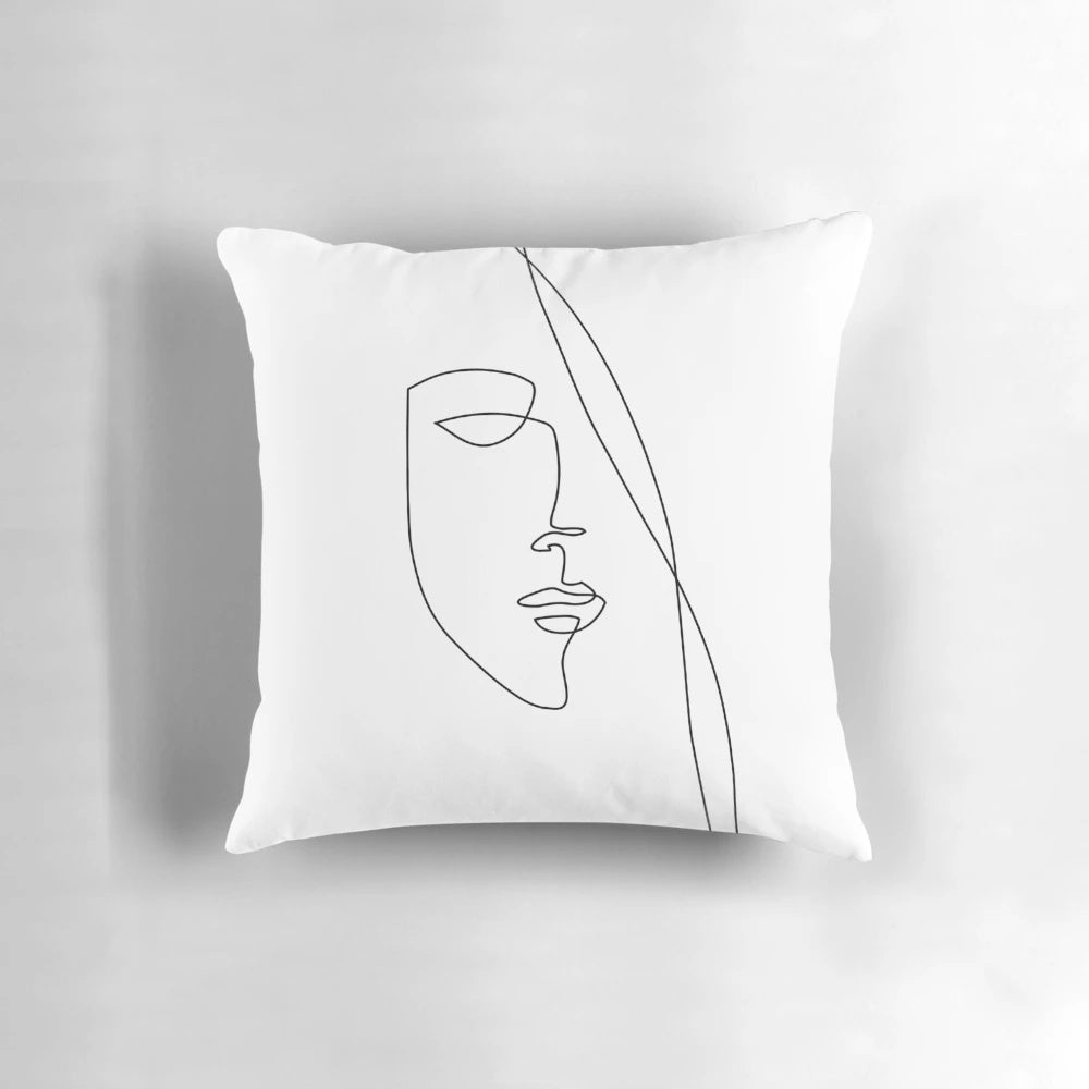 Elegant one line art sketch of a face on a black and white abstract pillow