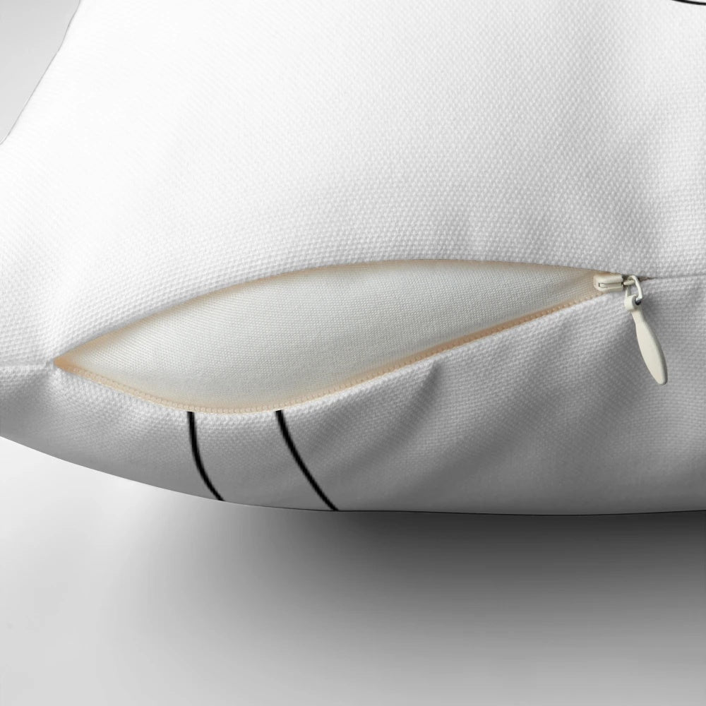 Elegant one line art sketch of a face on a black and white abstract pillow