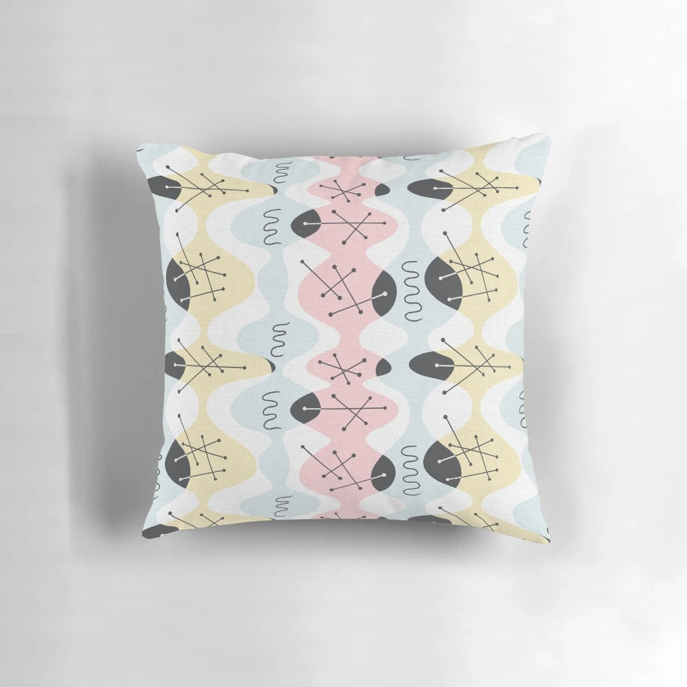 Organic Atomic Bambino Pillow with vibrant geometric pattern in pastel colors