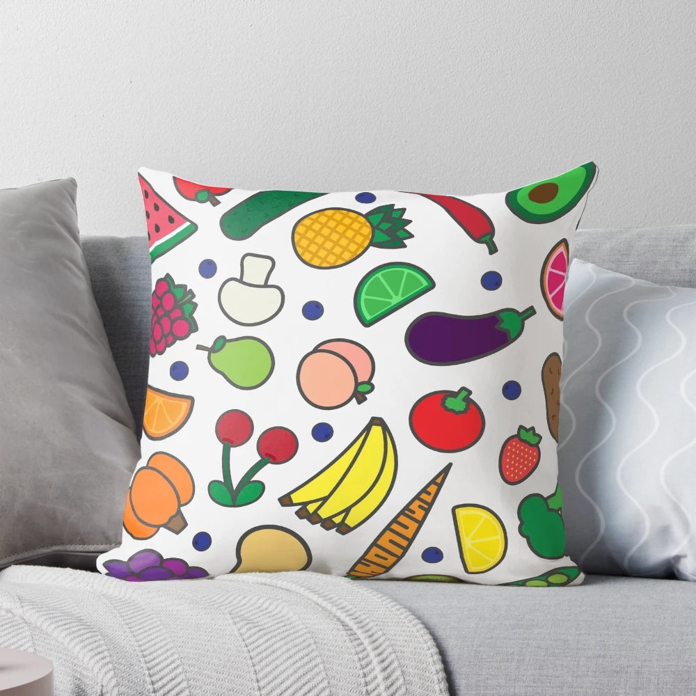 Colorful throw pillow featuring vibrant illustrations of assorted fruits and vegetables on a white background.