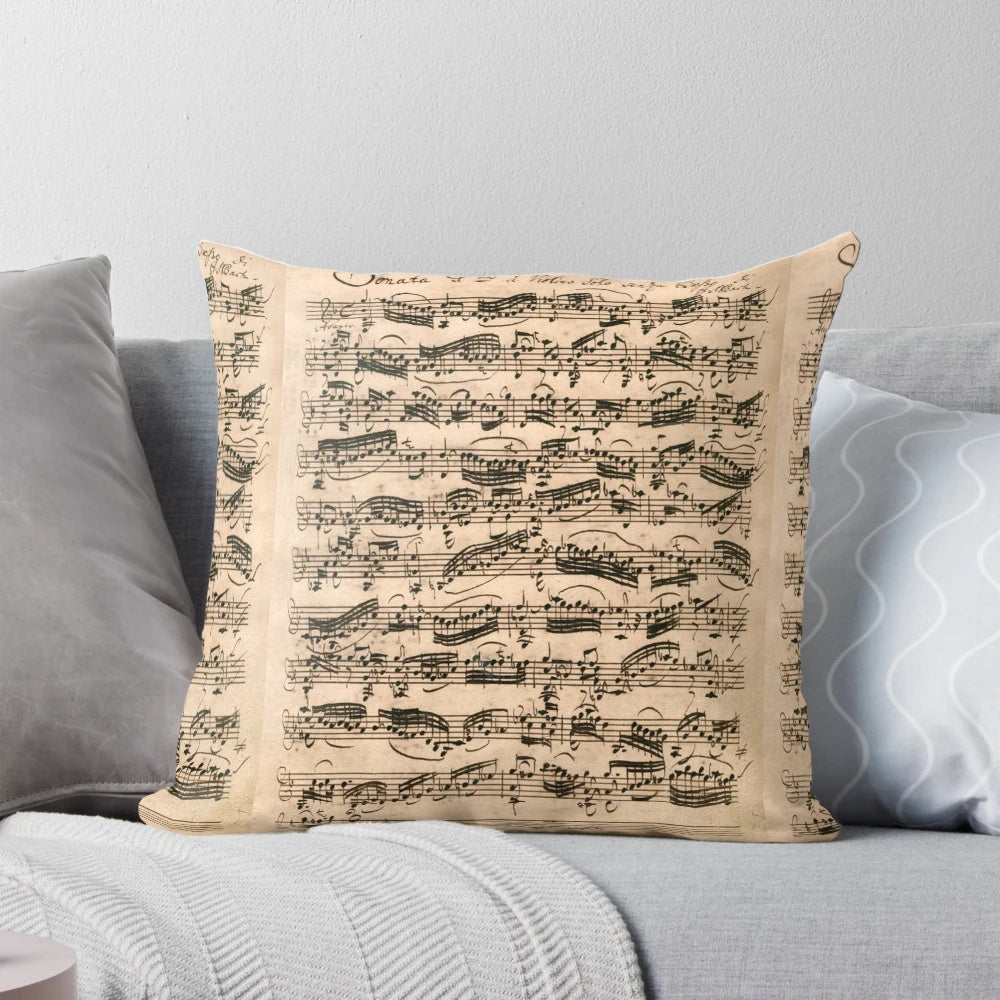 Original handwritten sheet music pillow featuring the compositions of classical composer Johann Sebastian Bach