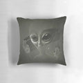 Plush alien pillow with a cosmic, sci-fi design for a unique home decor accent.