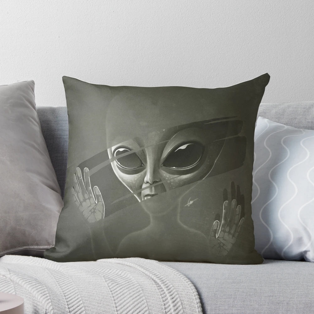 Plush alien pillow with a cosmic, sci-fi design for a unique home decor accent.