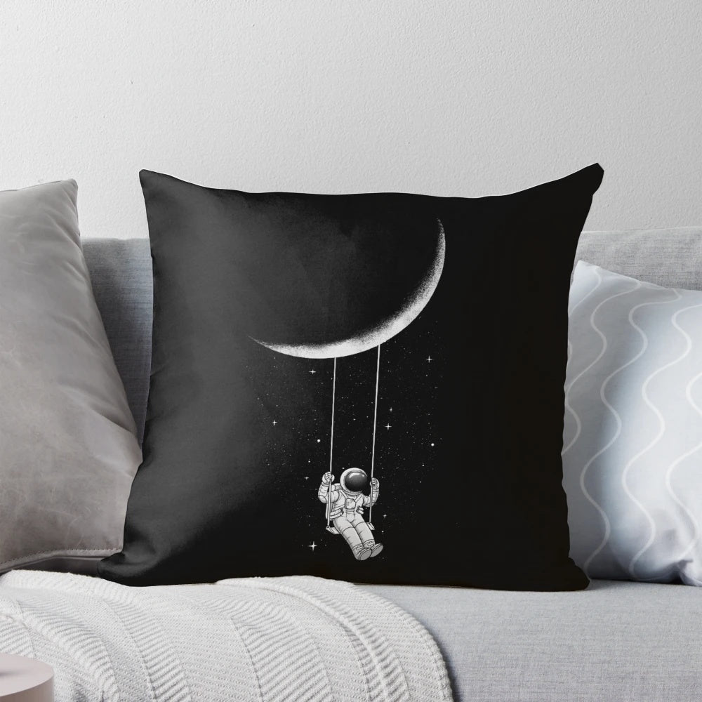 A black and white, surrealist-inspired pillow with a crescent moon design, perfect for creating a whimsical, out-of-this-world ambiance.