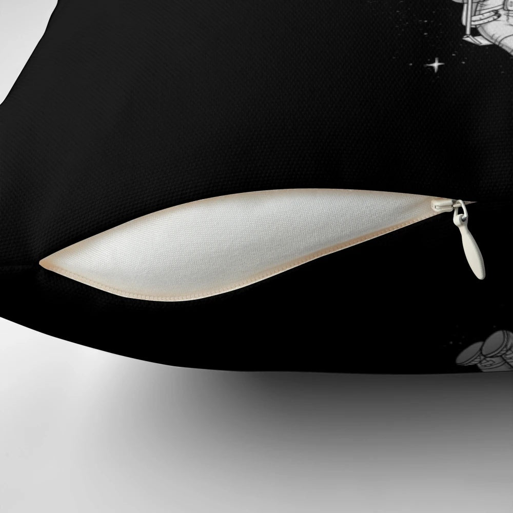 A black and white, surrealist-inspired pillow with a crescent moon design, perfect for creating a whimsical, out-of-this-world ambiance.