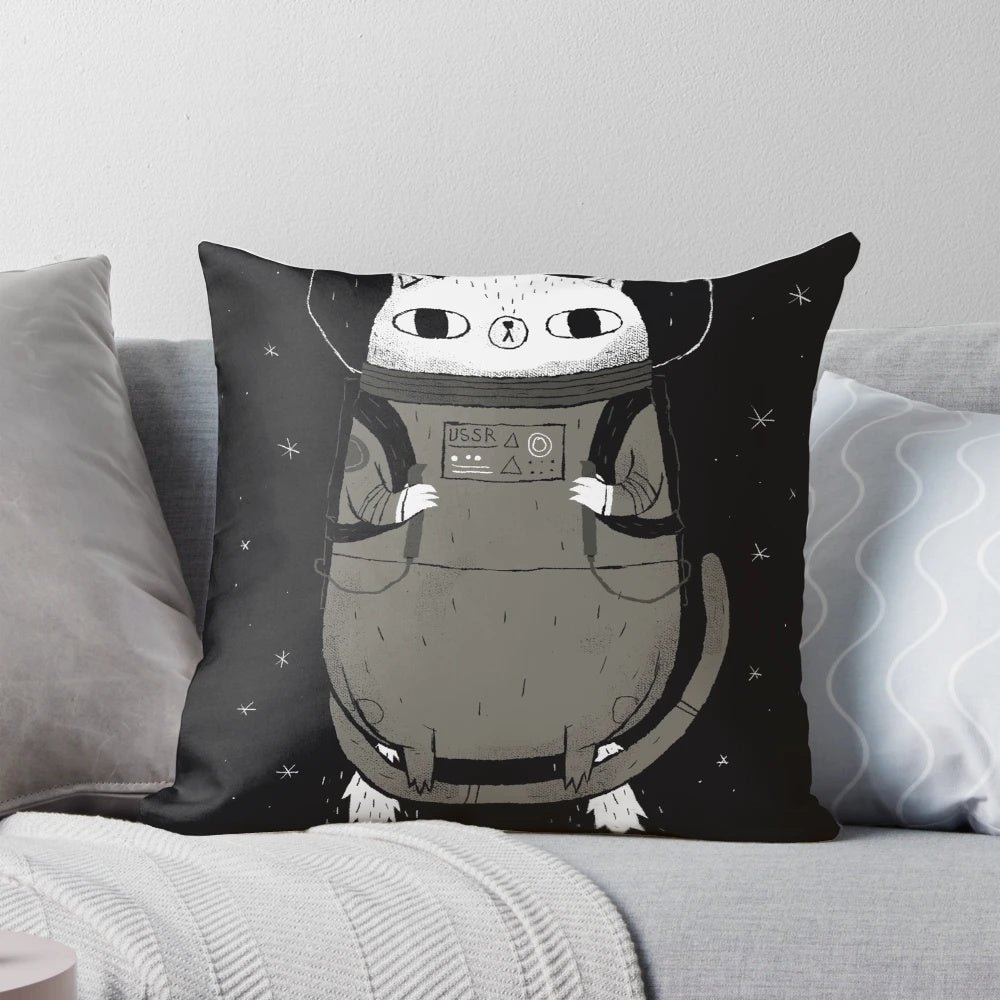 A cozy and whimsical space cat pillow with a cosmic, sci-fi design.