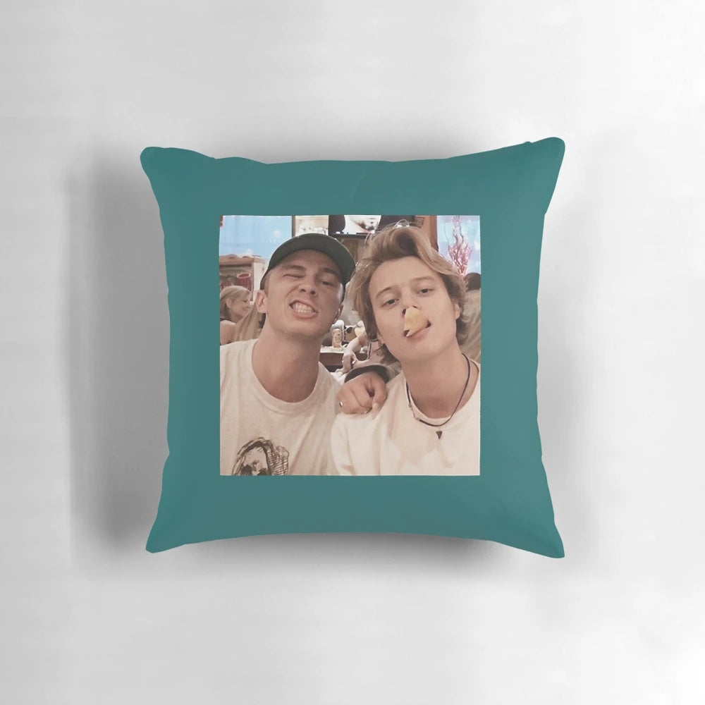 Outer Banks stars Drew Starkey and Rudy Pankow featured on a cozy, high-quality pillow