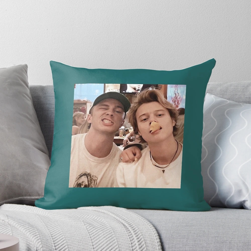 Outer Banks stars Drew Starkey and Rudy Pankow featured on a cozy, high-quality pillow