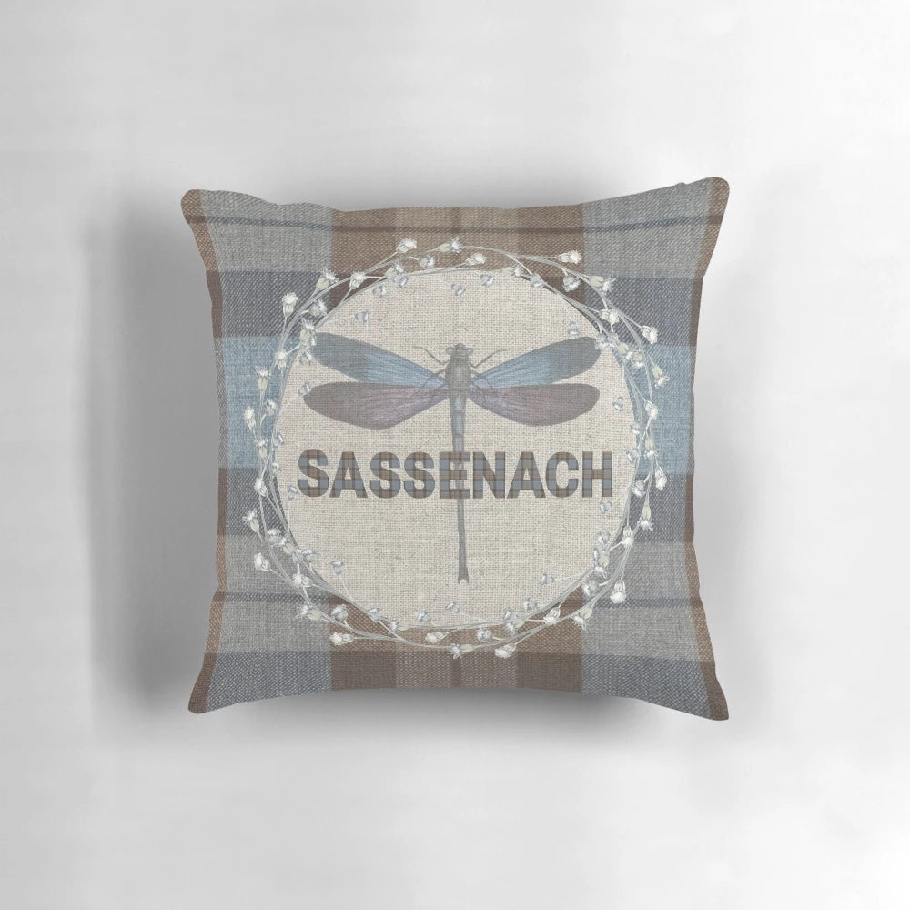 Outlander-inspired pillow featuring the Fraser tartan pattern and a dragonfly and thistle design