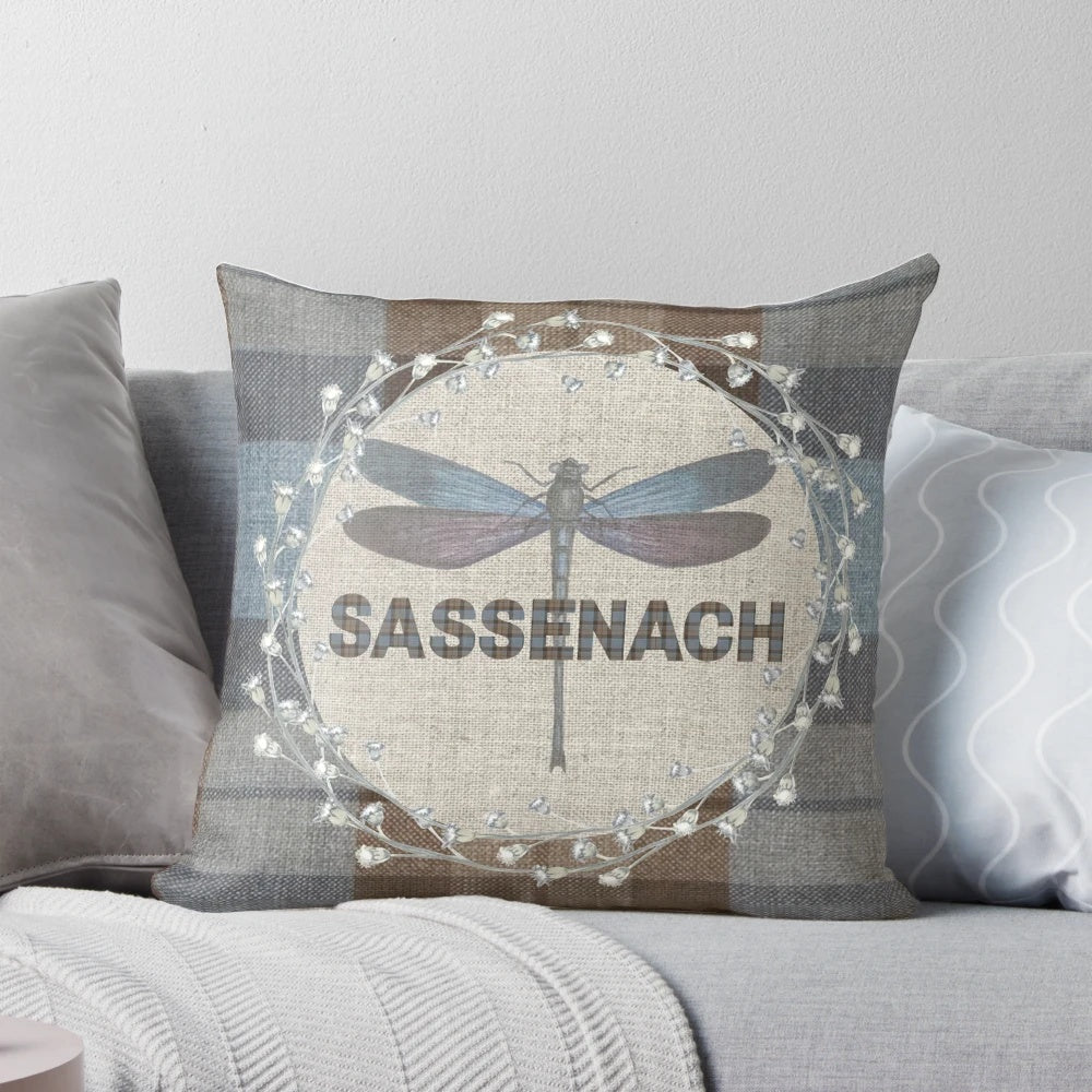 Outlander-inspired pillow featuring the Fraser tartan pattern and a dragonfly and thistle design