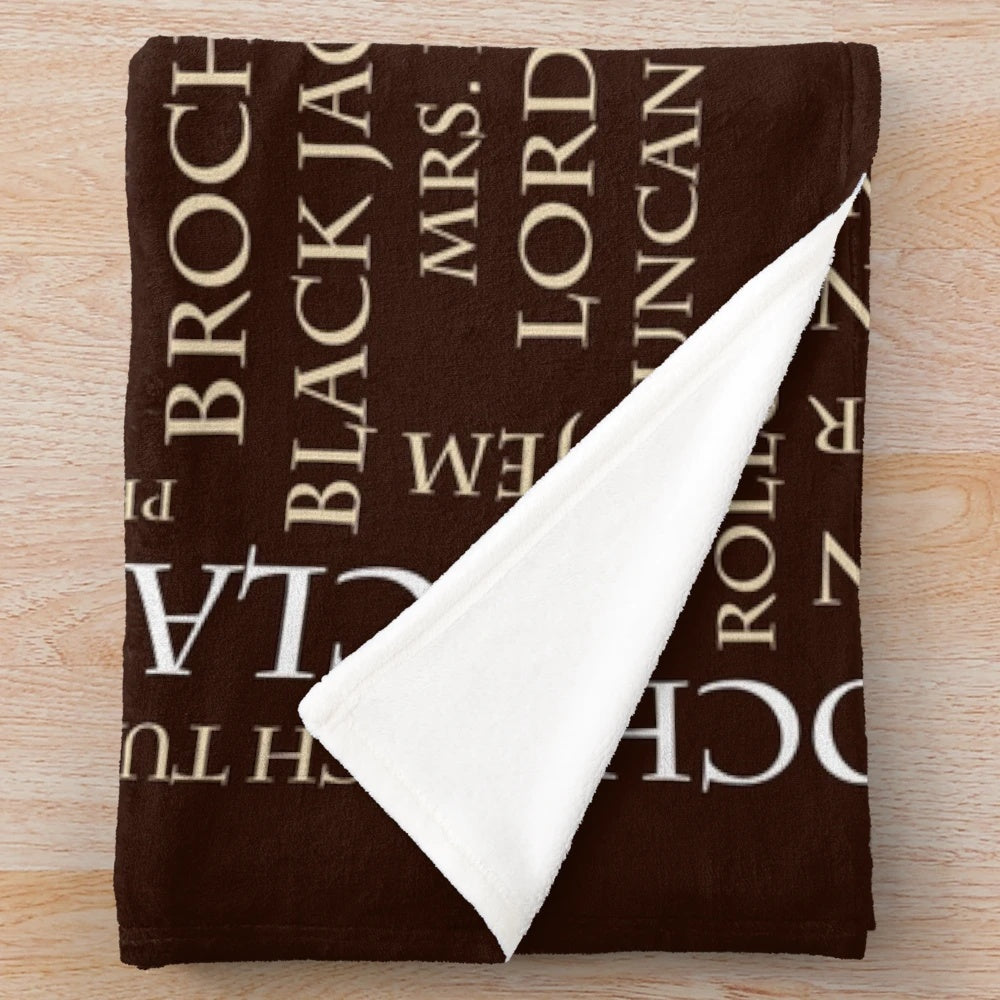 Outlander-inspired plush blanket with word cloud design featuring show elements