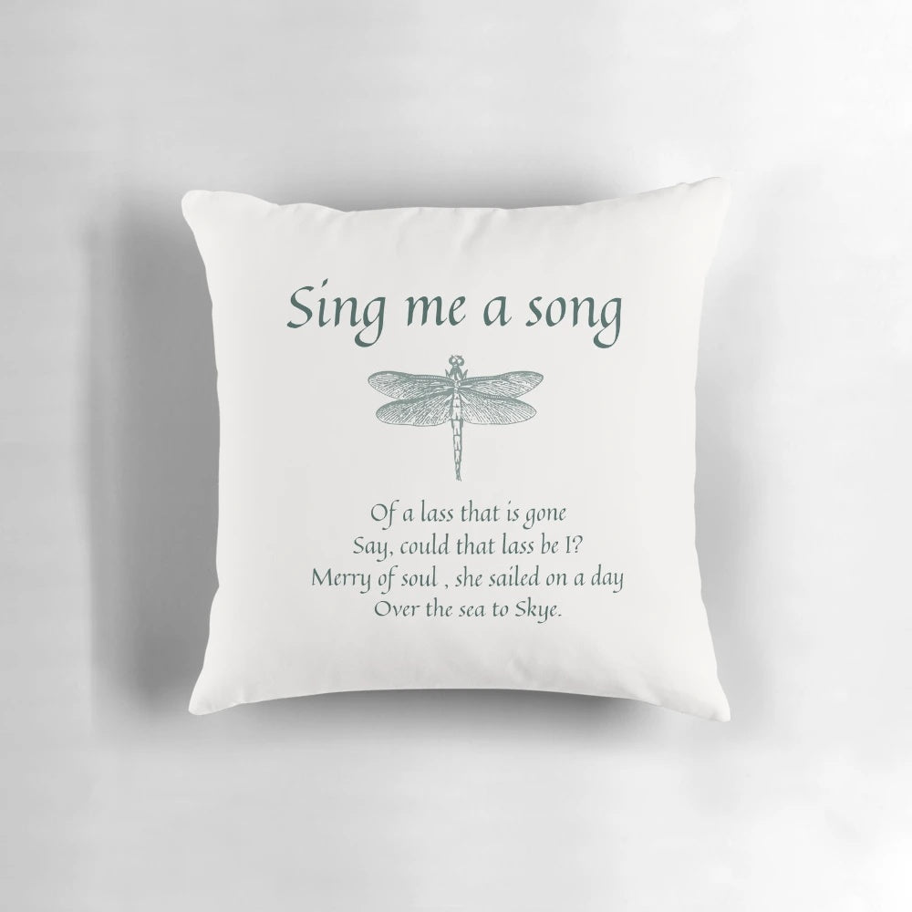 Soft, dark-colored pillow with embroidered 'Sing Me a Song' text, inspired by the Outlander series.