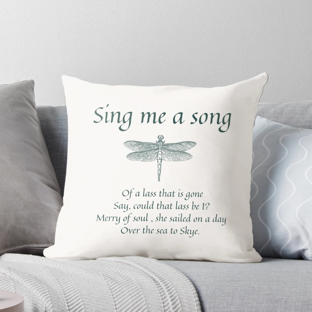 Soft, dark-colored pillow with embroidered 'Sing Me a Song' text, inspired by the Outlander series.