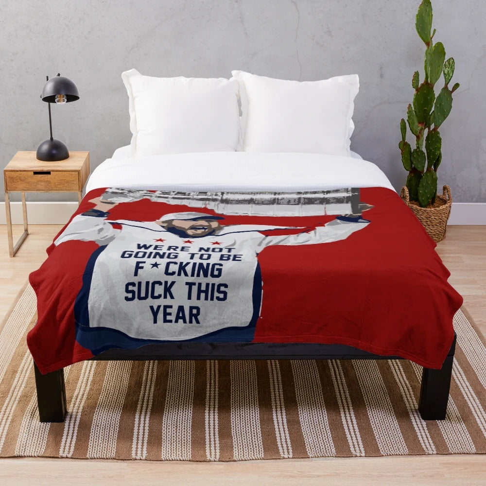 Soft and cozy plush blanket featuring a hockey player design
