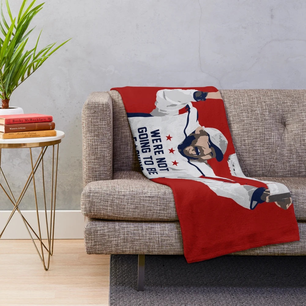 Soft and cozy plush blanket featuring a hockey player design