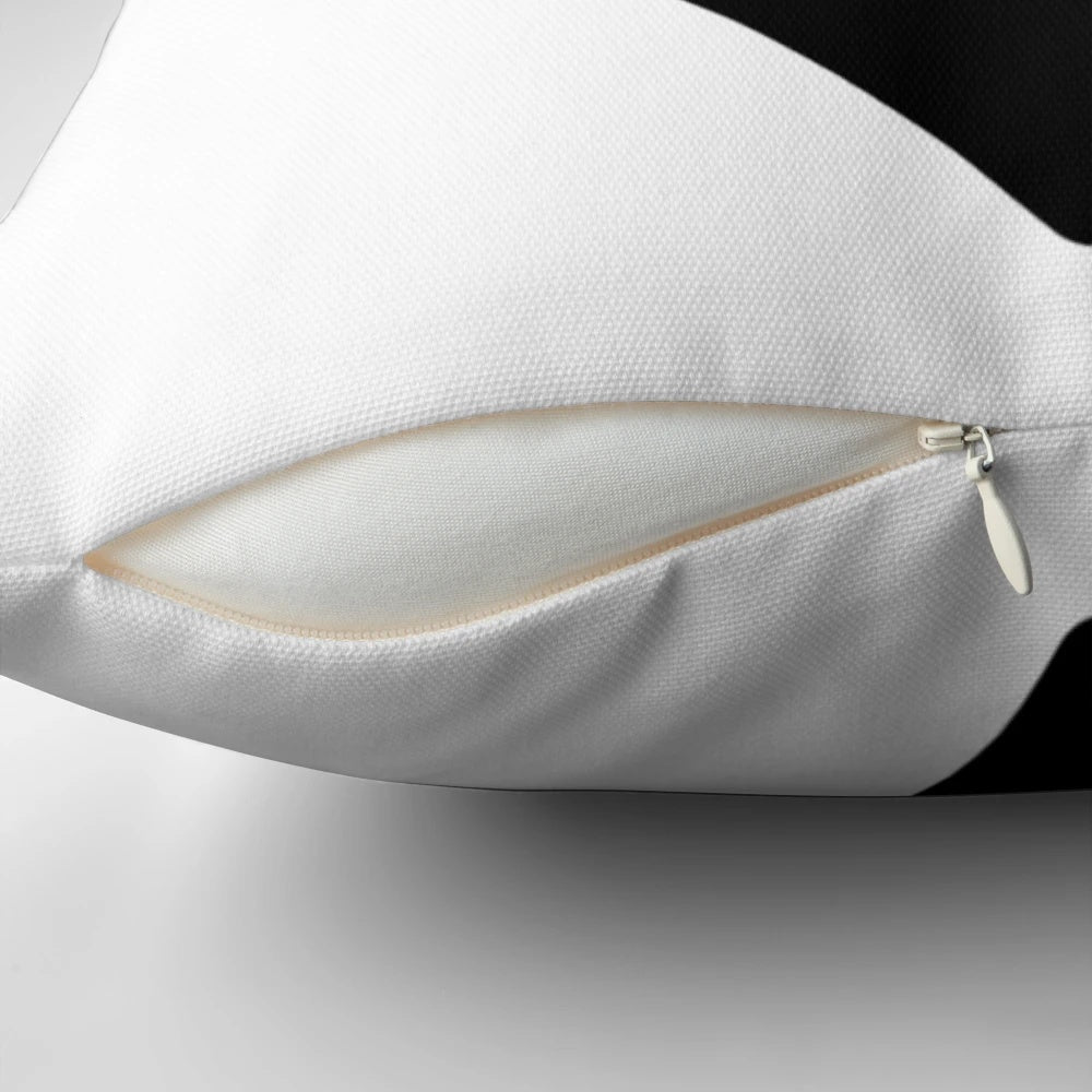 Photograph of a large black heart-shaped pillow, a cozy and enchanting addition to any living space.