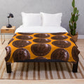 Oversized plush blanket featuring a giant jaffa cake design