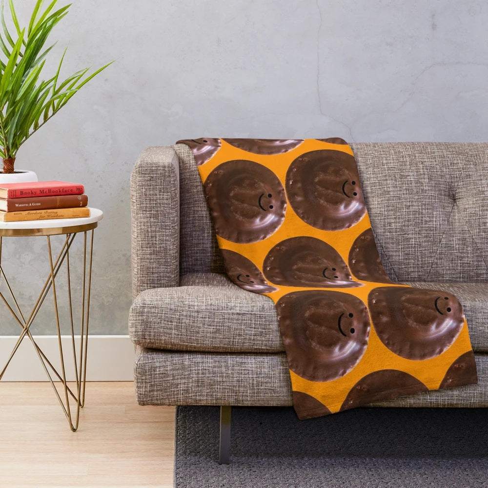 Oversized plush blanket featuring a giant jaffa cake design