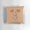 Oversized Nicolas Cage face graphic printed on a large, plush pillow