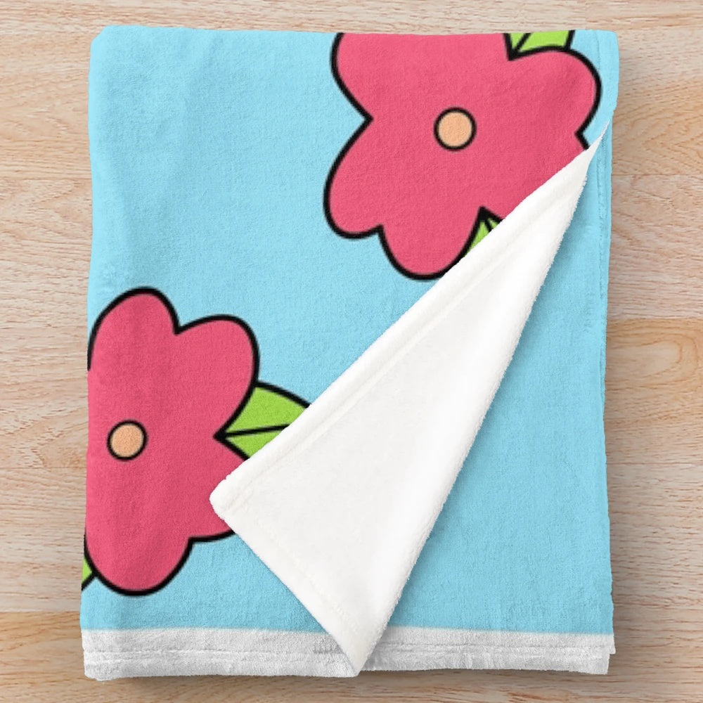 Plush blanket featuring a colorful Hawaiian-inspired floral print, inspired by Homer Simpson's iconic muumuu