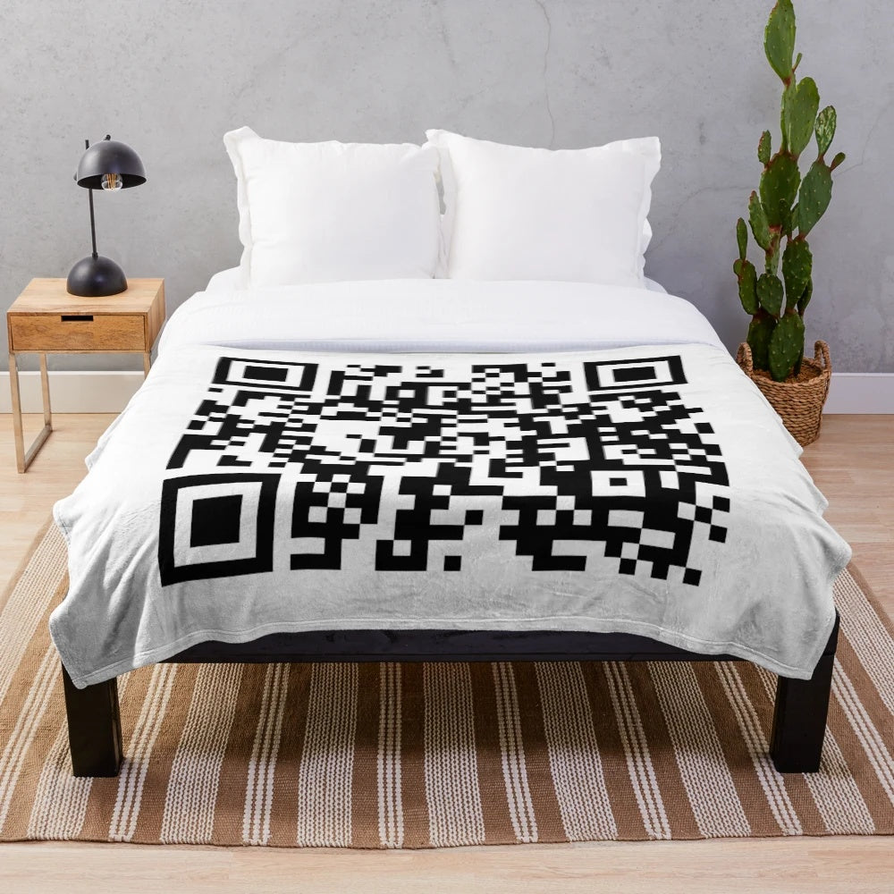 Oversized plush blanket featuring a large QR code design that links to the "Never Gonna Give You Up" music video by Rick Astley