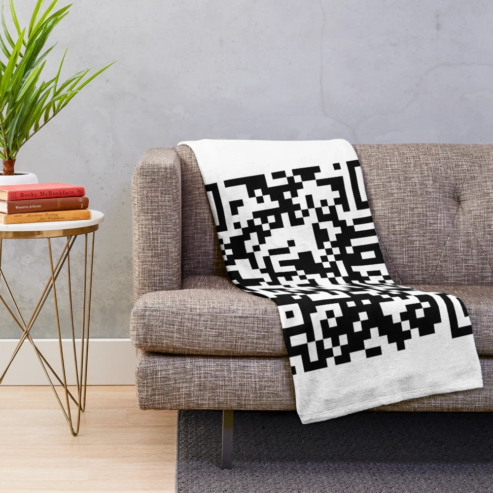 Oversized plush blanket featuring a large QR code design that links to the "Never Gonna Give You Up" music video by Rick Astley