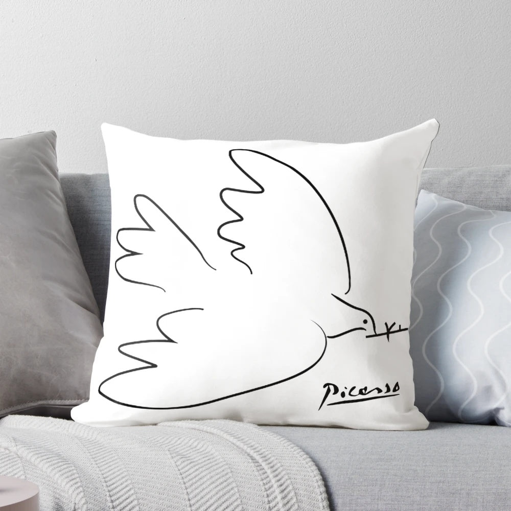 A modern and minimalist pillow design featuring a dove of peace in a line art style, inspired by the work of Pablo Picasso.