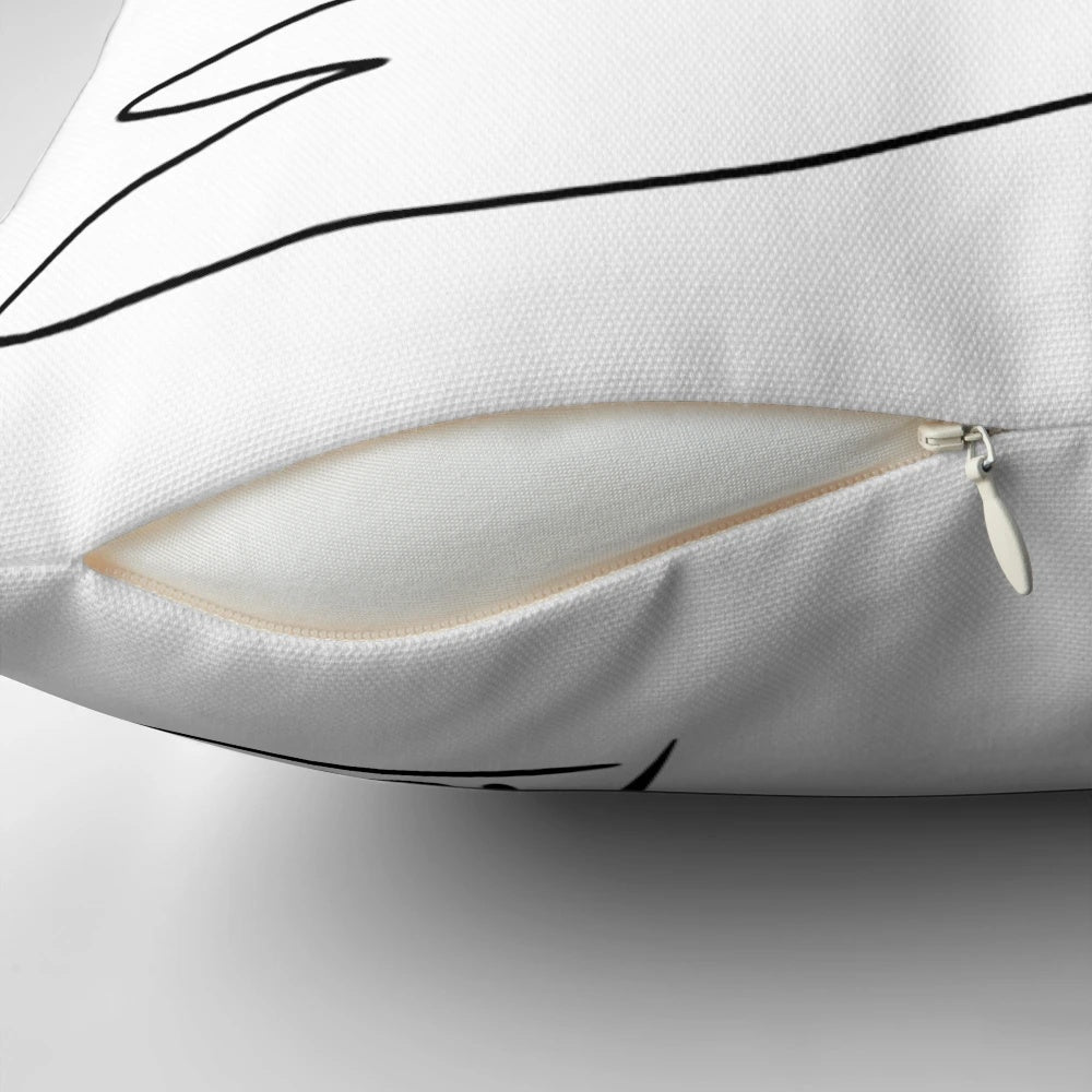 A modern and minimalist pillow design featuring a dove of peace in a line art style, inspired by the work of Pablo Picasso.