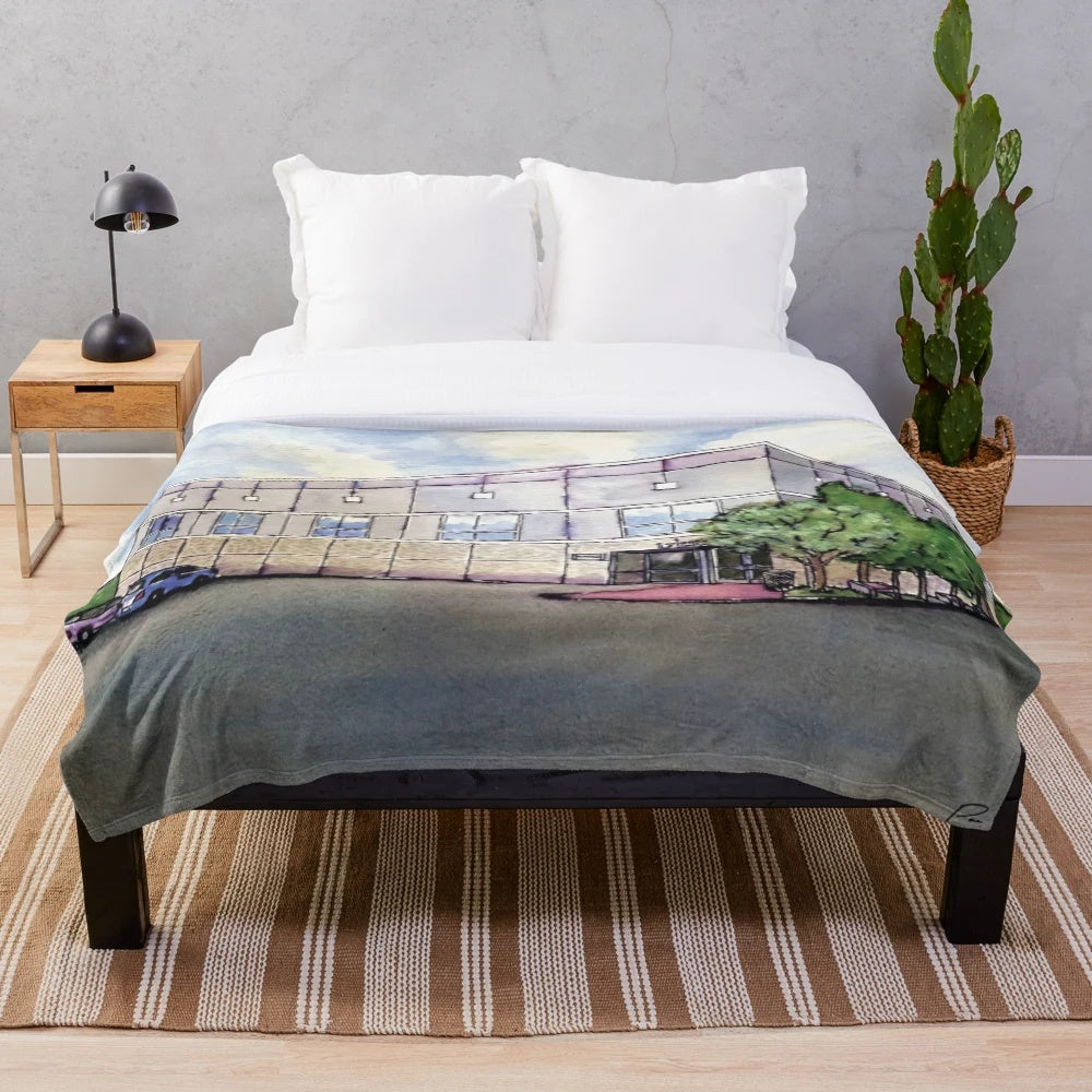 A cozy plush blanket featuring a watercolor design of Pam Beesly and Jim Halpert from the popular TV show, The Office.