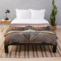 Plush blanket featuring an illustration of the iconic Louvre Museum in Paris