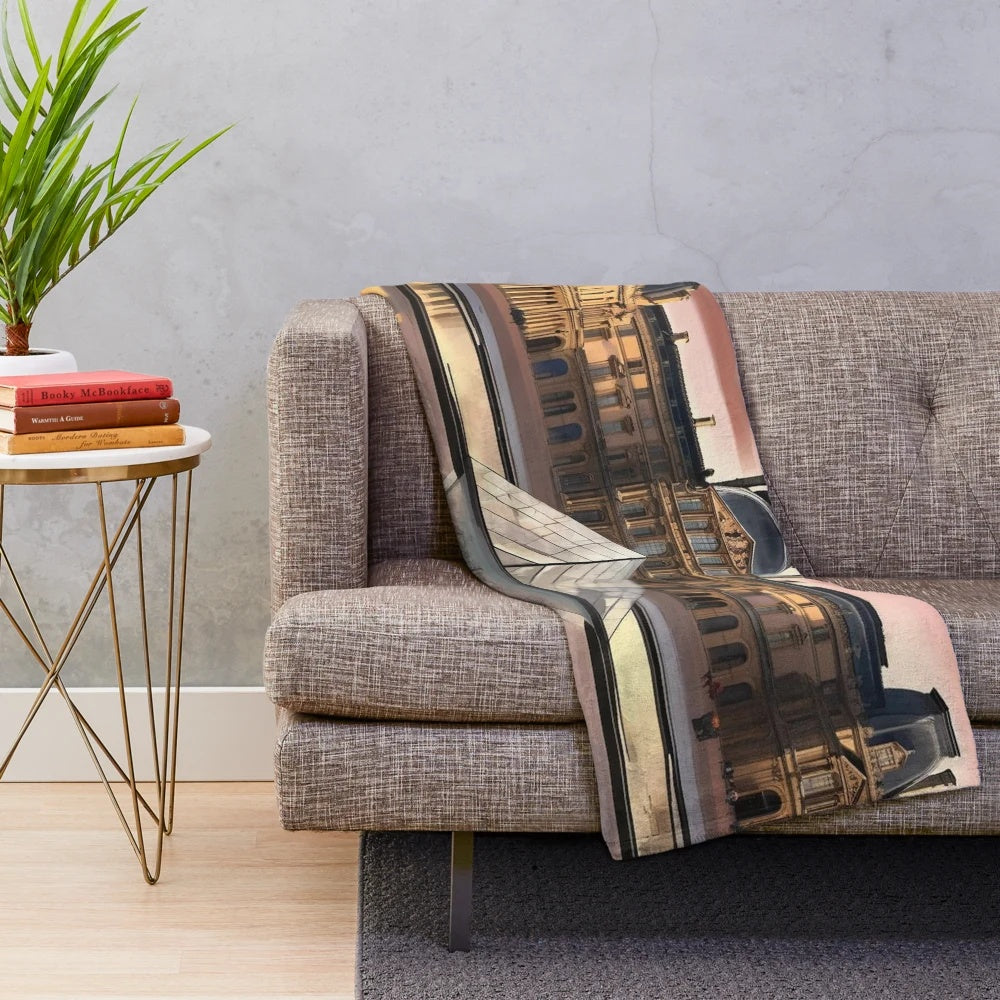 Plush blanket featuring an illustration of the iconic Louvre Museum in Paris