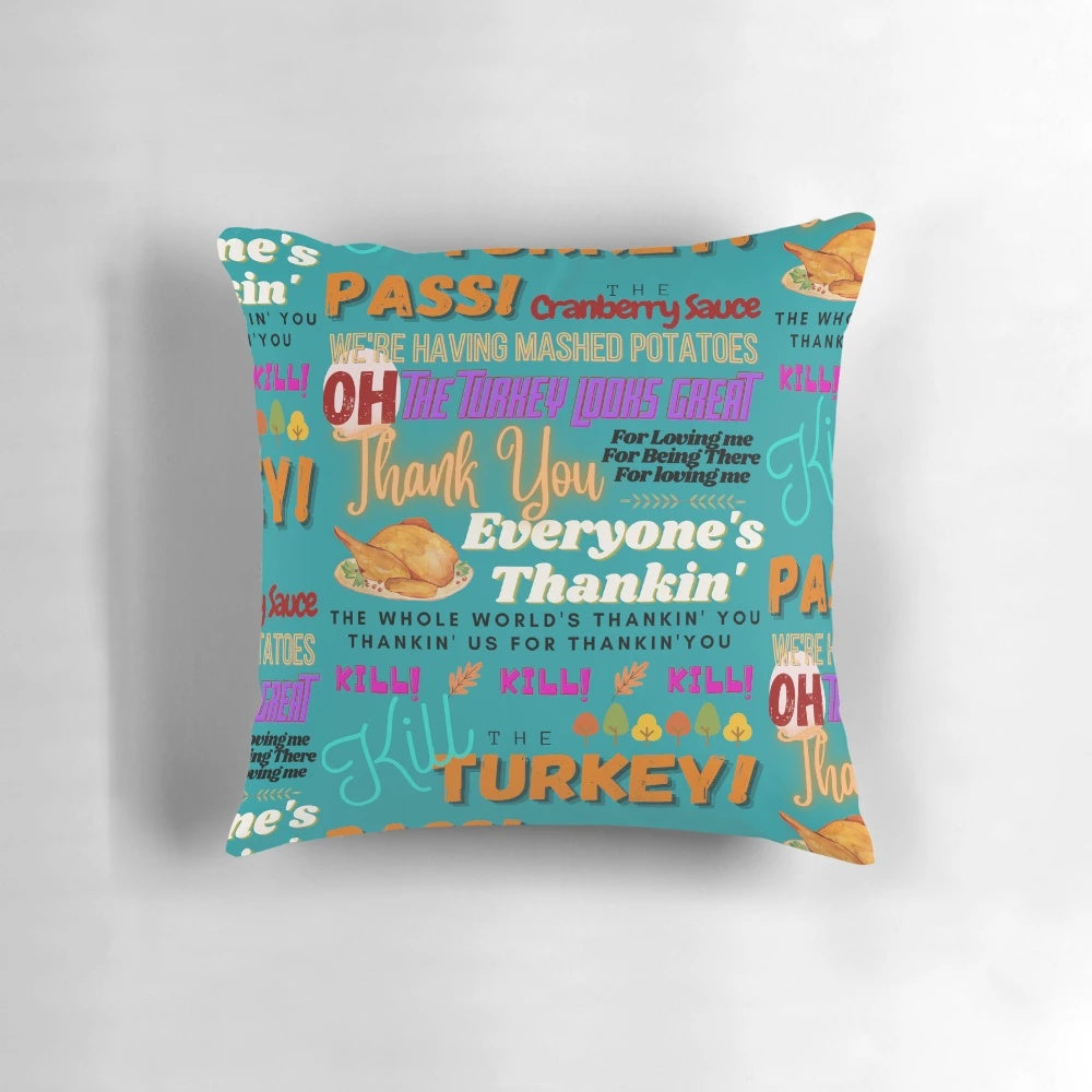 A vibrant throw pillow featuring the text "Pass the Cranberry Sauce" in a festive Thanksgiving design.
