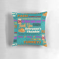 A vibrant throw pillow featuring the text "Pass the Cranberry Sauce" in a festive Thanksgiving design.