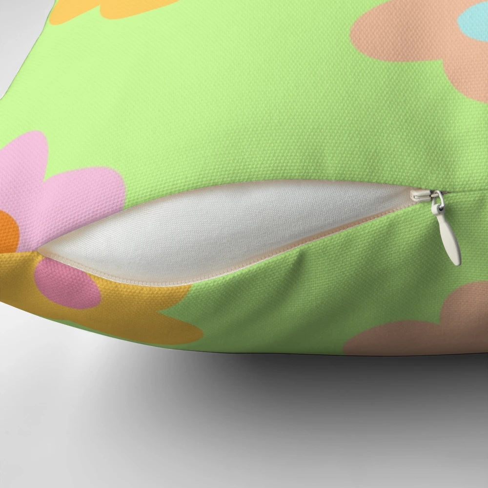 Pastel 5-petal floral aesthetic pillow with soft, green colors