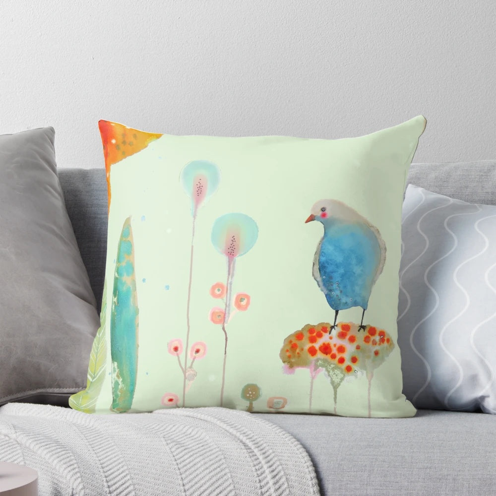 Pastel-colored bird and floral design on a soft, modern pillow for nursery or home decor.