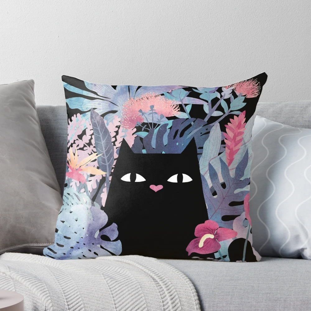 Pastel black velvet pillow with a tropical floral design featuring a cute black cat