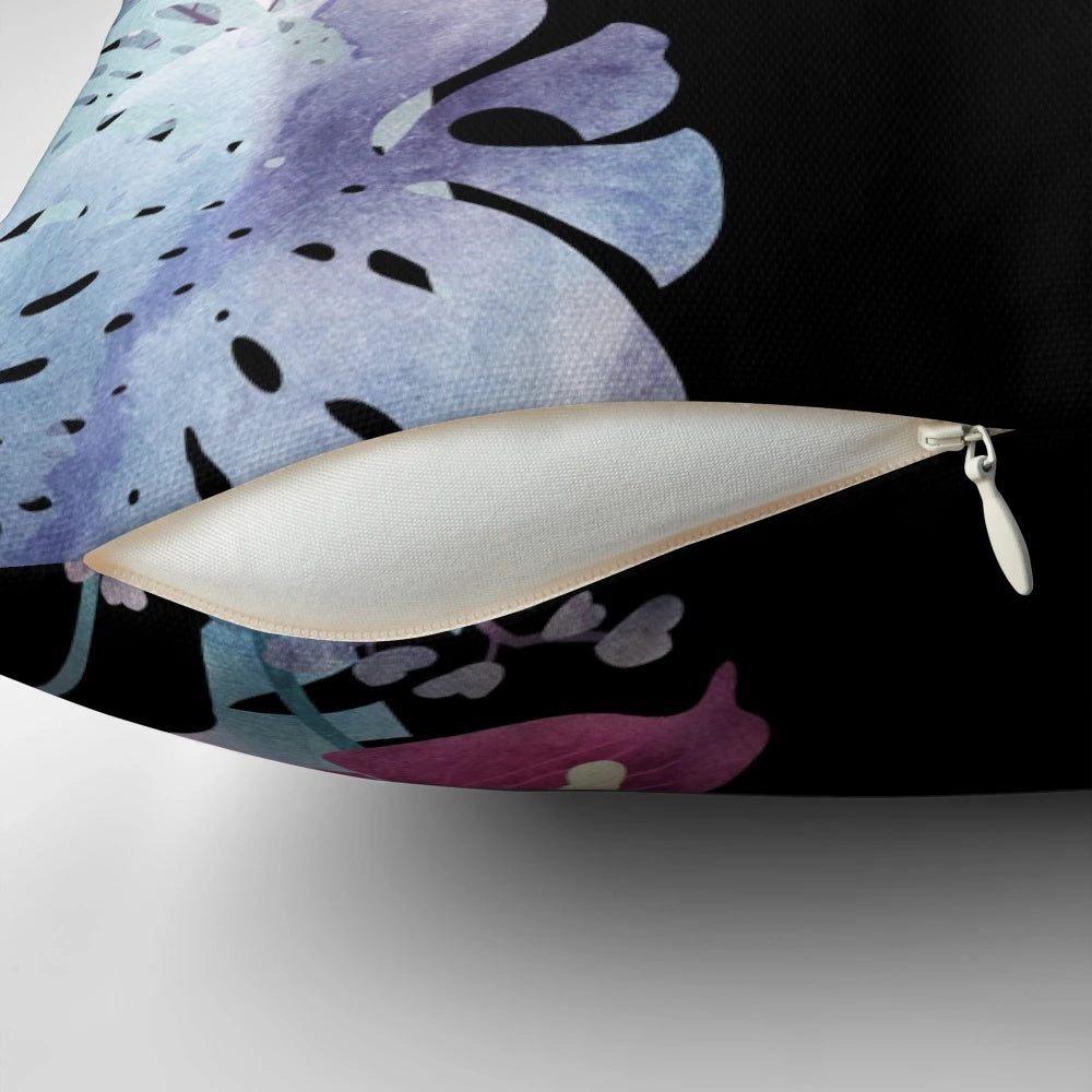 Pastel black velvet pillow with a tropical floral design featuring a cute black cat