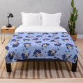 Pastel blue plush blanket with dice casino pattern design