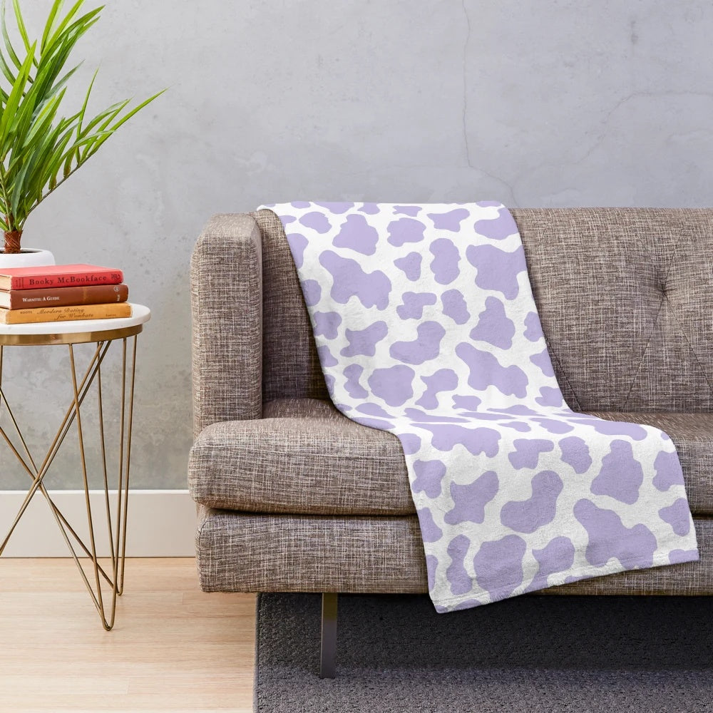 Soft and cozy pastel cow print plush blanket for aesthetic-inspired decor