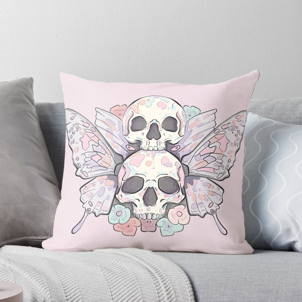 A pastel-colored pillow featuring a striking image of a death moth or butterfly skull, creating a darkly elegant and eerie décor piece.