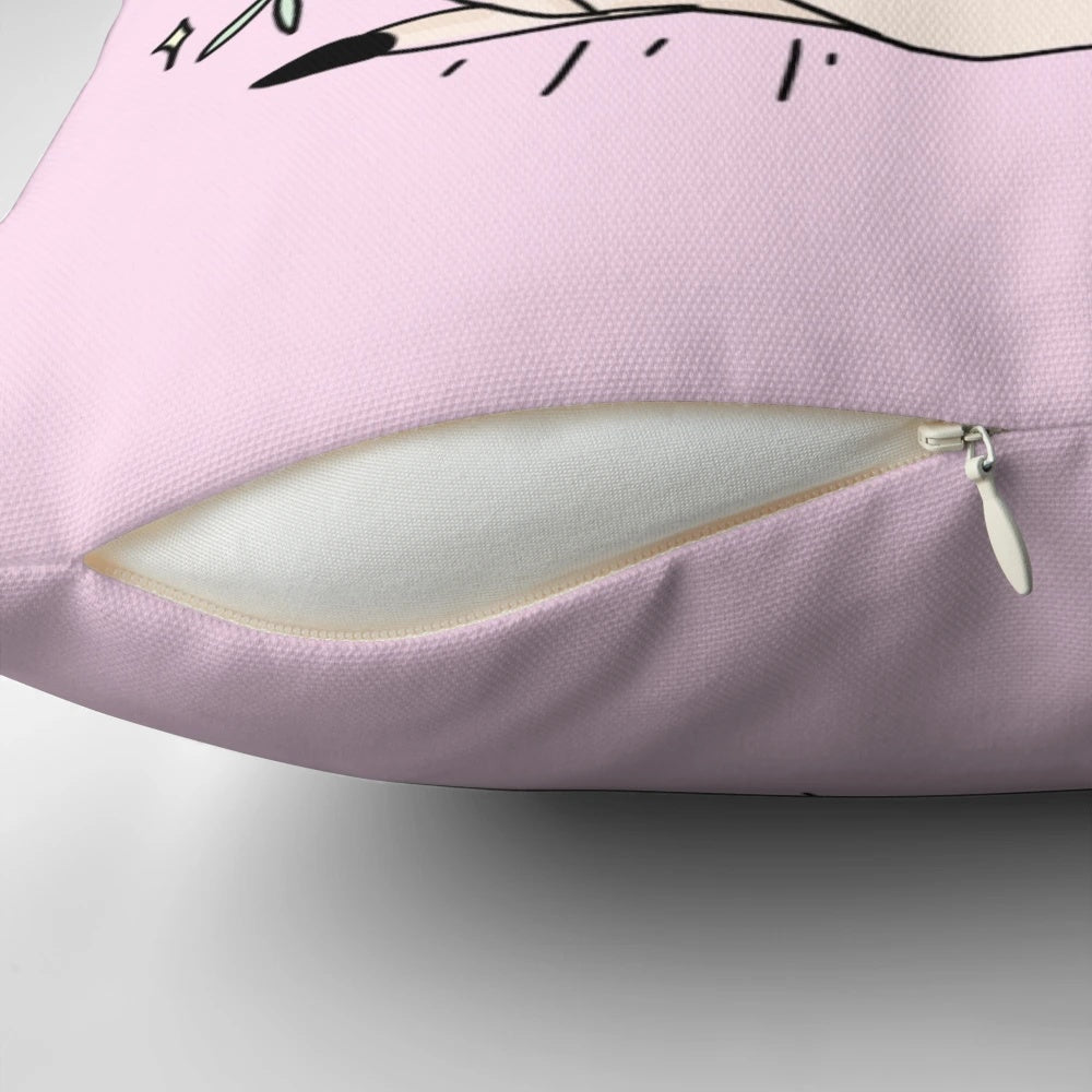 A pastel pink pillow featuring a beautiful floral design, with a touch of mystical elements like a crystal ball, perfect for creating a cozy and whimsical atmosphere.