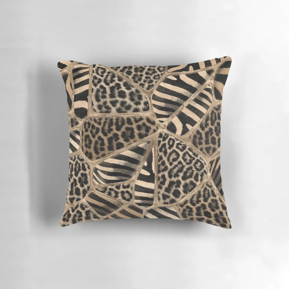 Pastel gold pillow with a geometric animal print design featuring leopard and zebra patterns.