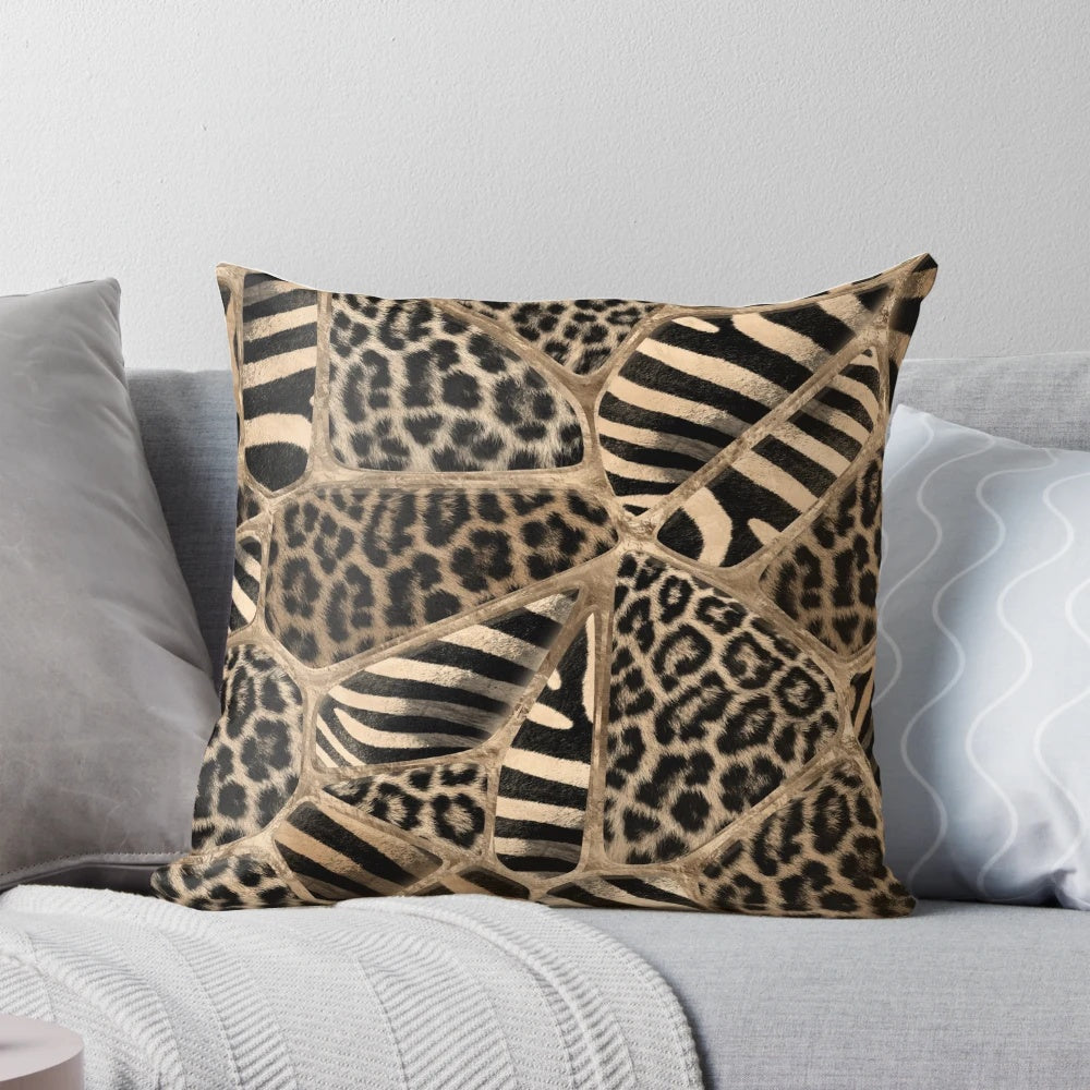Pastel gold pillow with a geometric animal print design featuring leopard and zebra patterns.