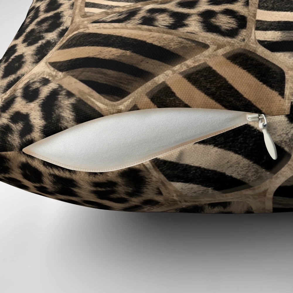 Pastel gold pillow with a geometric animal print design featuring leopard and zebra patterns.