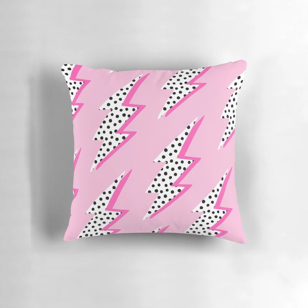 Pastel pink pillow with a graphic lightning bolt design