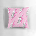 Pastel pink pillow with a graphic lightning bolt design