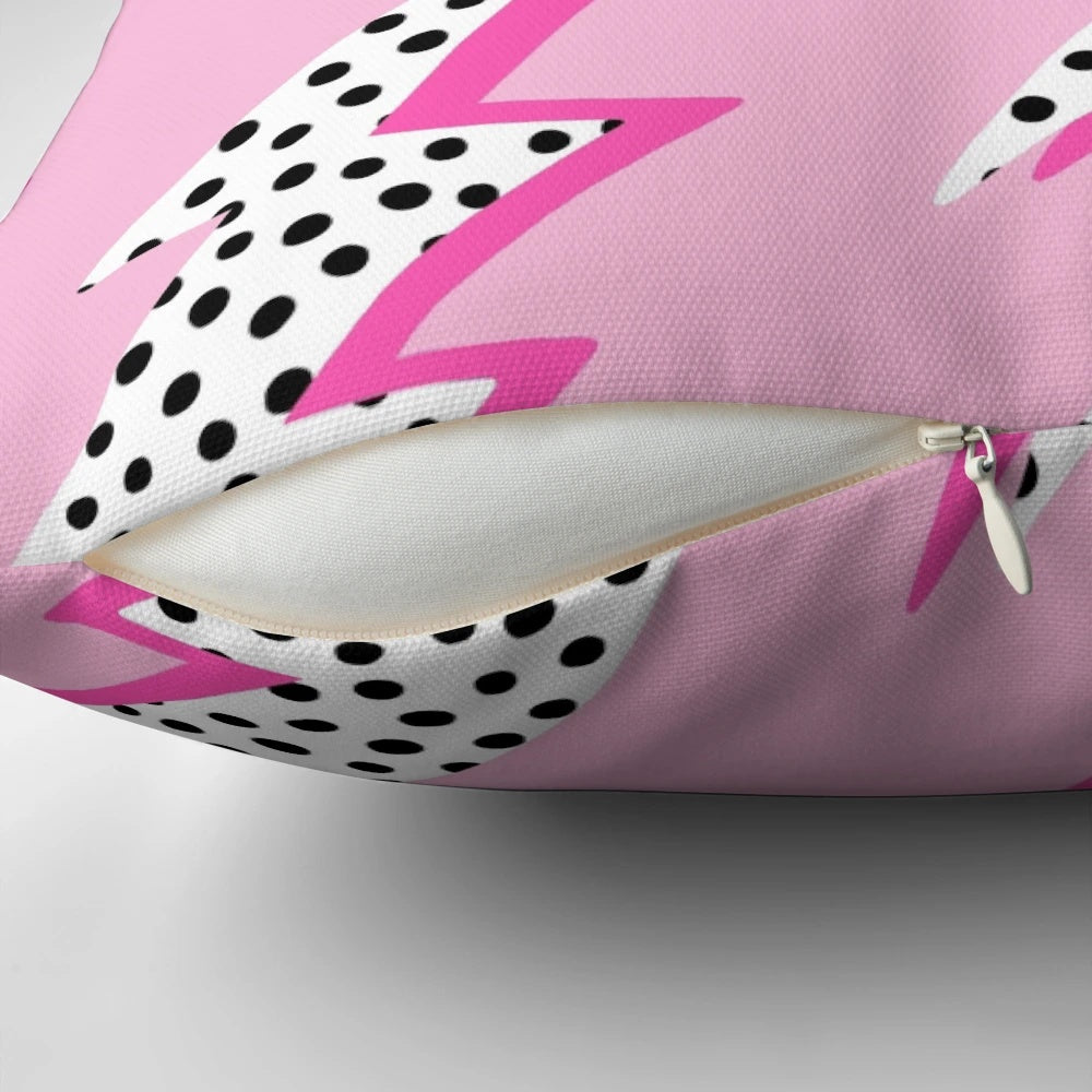 Pastel pink pillow with a graphic lightning bolt design